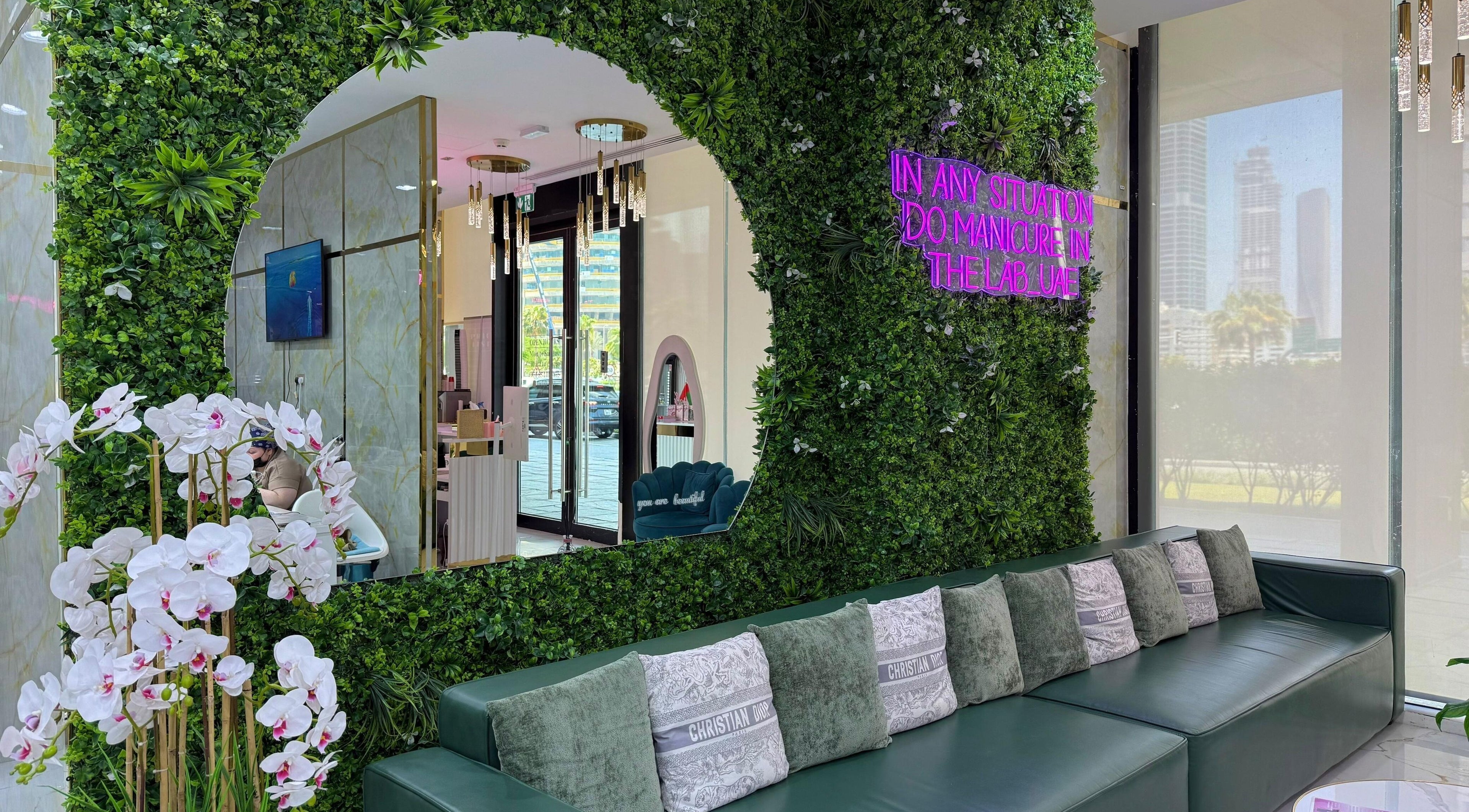 Elegant interior of Adelya Al Medina Beauty Salon in Dubai, AE. Features lush greenery and ambient decor.