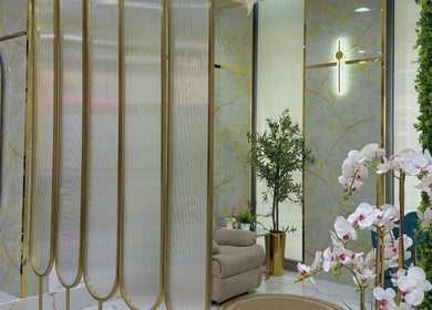Luxurious interior of Adelya Al Medina Beauty Salon in Dubai, AE with elegant decor and lush greenery.