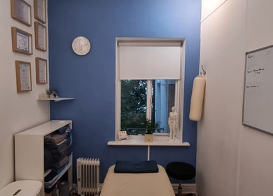 Treatment room at The Peak Wellness Studio with blue wall and therapy setup in Dublin, County Dublin, IE.