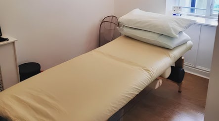 Massage table in The Peak Wellness Studio, Dublin, County Dublin, IE, offers a tranquil setting.