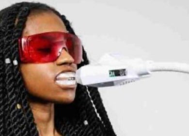Teeth whitening session at Simplybrite in Northwood, England, GB featuring protective eyewear.