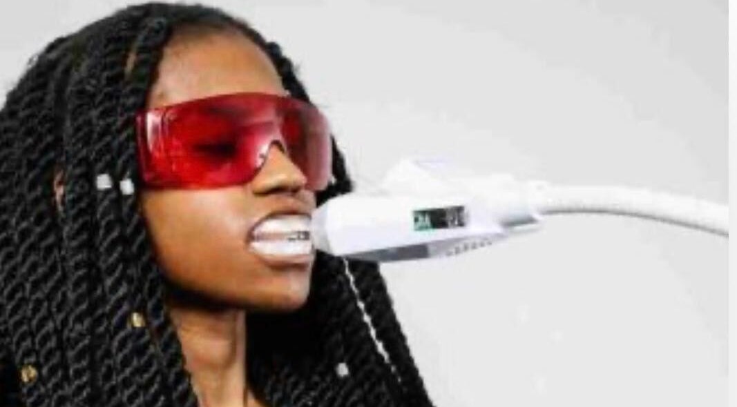Teeth whitening session at Simplybrite in Northwood, England, GB featuring protective eyewear.