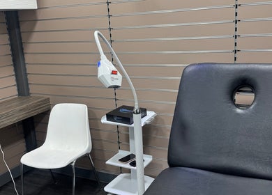 Simplybrite's treatment room in Northwood, England, GB, featuring a comfy chair and modern dental equipment.