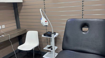 Simplybrite's treatment room in Northwood, England, GB, featuring a comfy chair and modern dental equipment.
