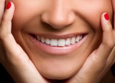 Close-up of a radiant smile with red nails at Simplybrite, Northwood, England, GB.
