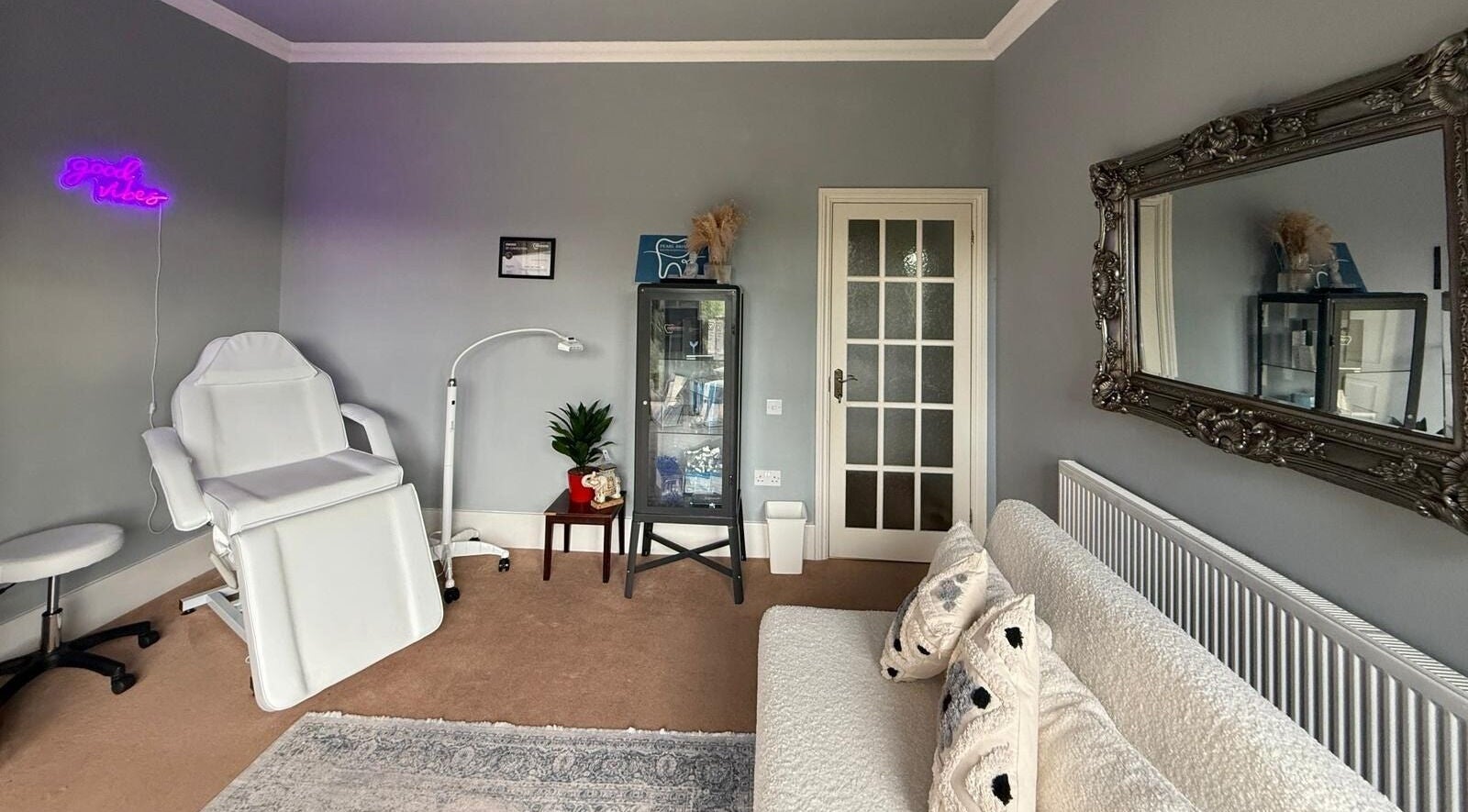 Relaxing treatment room at Pearl Brite, Newport, Wales, GB, featuring a plush chair and elegant decor.
