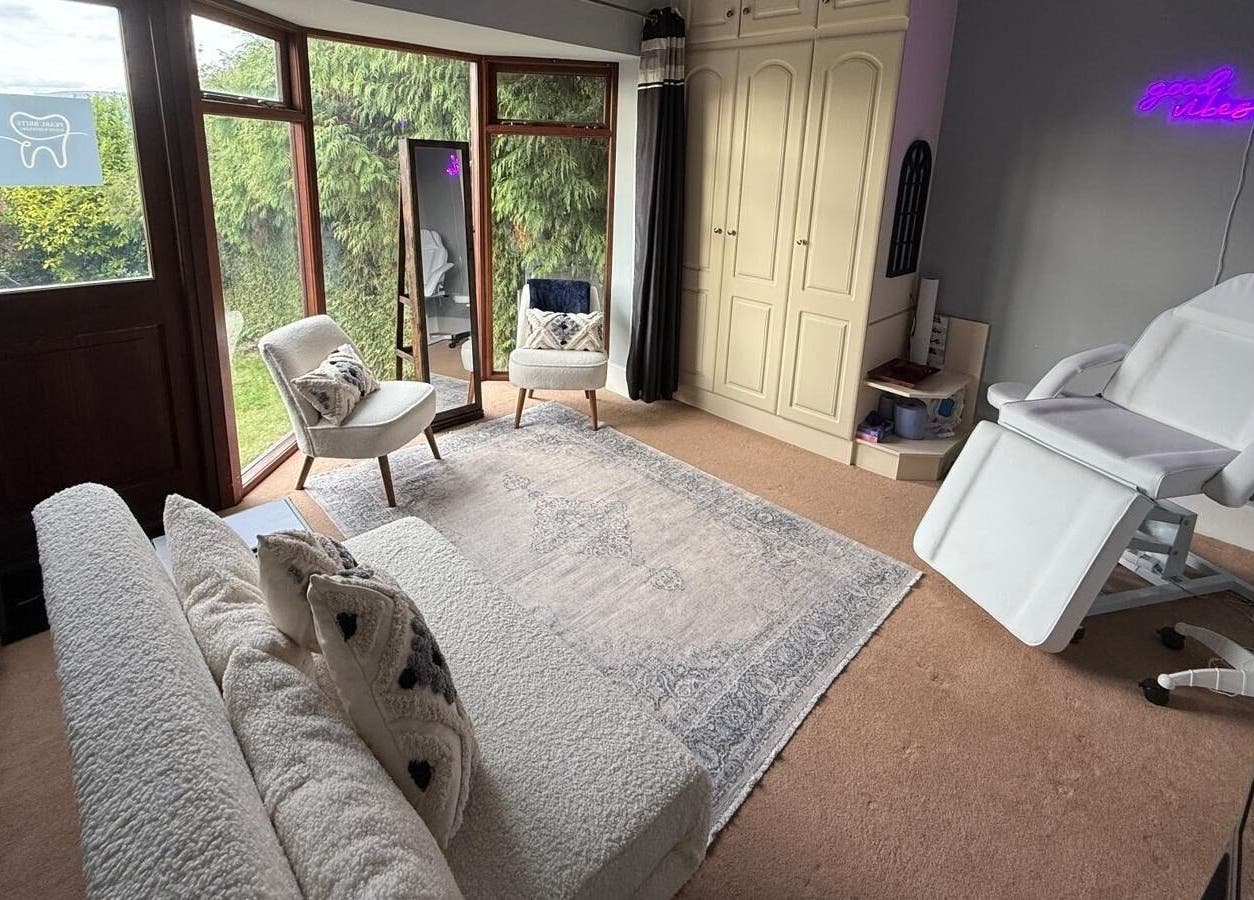 Cozy beauty room in Pearl Brite, Newport, Wales, GB with comfy chairs, soft lighting, and elegant decor.