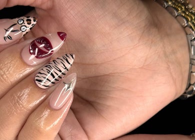 Artistic nail designs at Refined By Courtney Joyce, Hucclecote, England, GB, featuring intricate patterns.