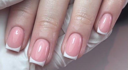 French manicure at Refined By Courtney Joyce, Hucclecote, England, GB. Gleaming pink nails with white tips.