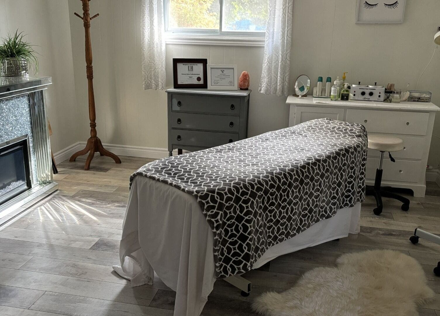 Tranquil treatment room at Elegance Esthetics, Simcoe, Ontario, CA, featuring a comfortable massage table.