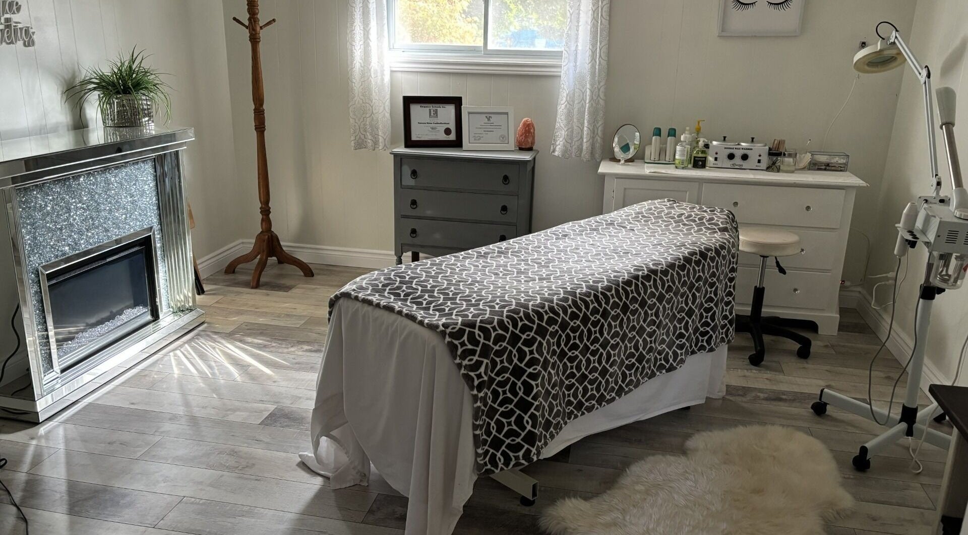 Tranquil treatment room at Elegance Esthetics, Simcoe, Ontario, CA, featuring a comfortable massage table.