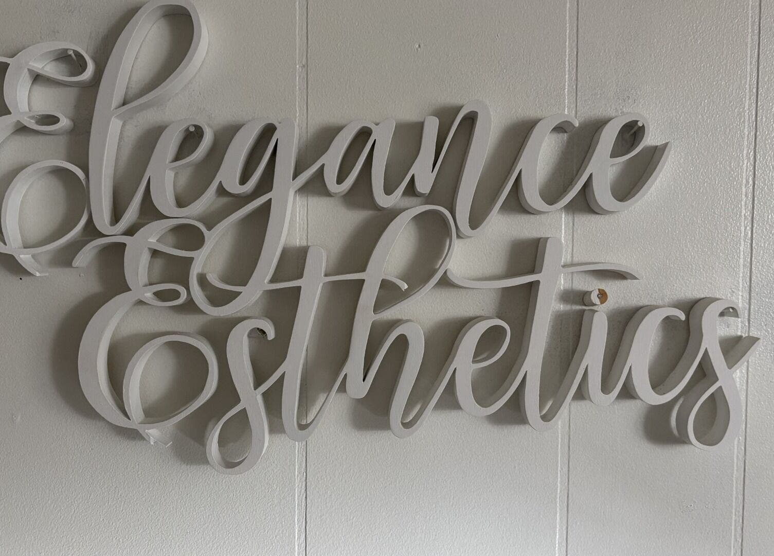 Elegant wall script of Elegance Esthetics at Simcoe, Ontario, CA, showcasing a chic venue decor.