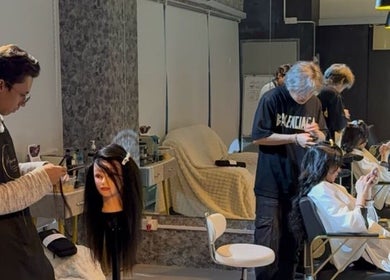 Stylists at Marone Private Hair Extension and Hair Studio, Kuala Lumpur, attending to clients in a modern setting.