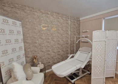Relaxing treatment room at Beautybyrumaysa, Stoke-on-Trent, England, GB with a comfy chair and bed.