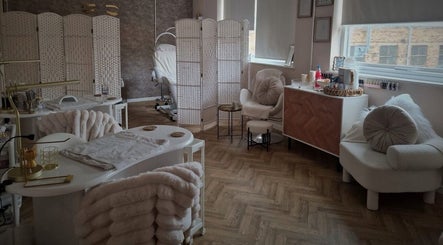 Elegant beauty room at Beautybyrumaysa, Stoke-on-Trent, England, GB featuring plush seating and treatment spaces.
