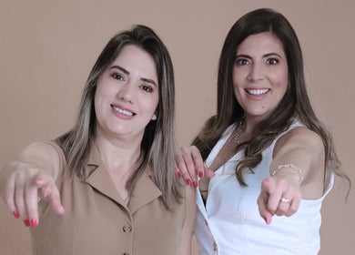 Two smiling women pointing at Harmony Aesthetic & Spa, Goose Creek, South Carolina, US.