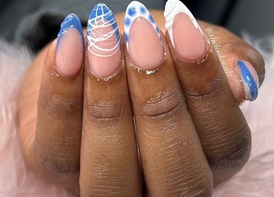Elegant blue and white nail art at The Look Nails By Taria, Marsh Harbour, Central Abaco, BS.