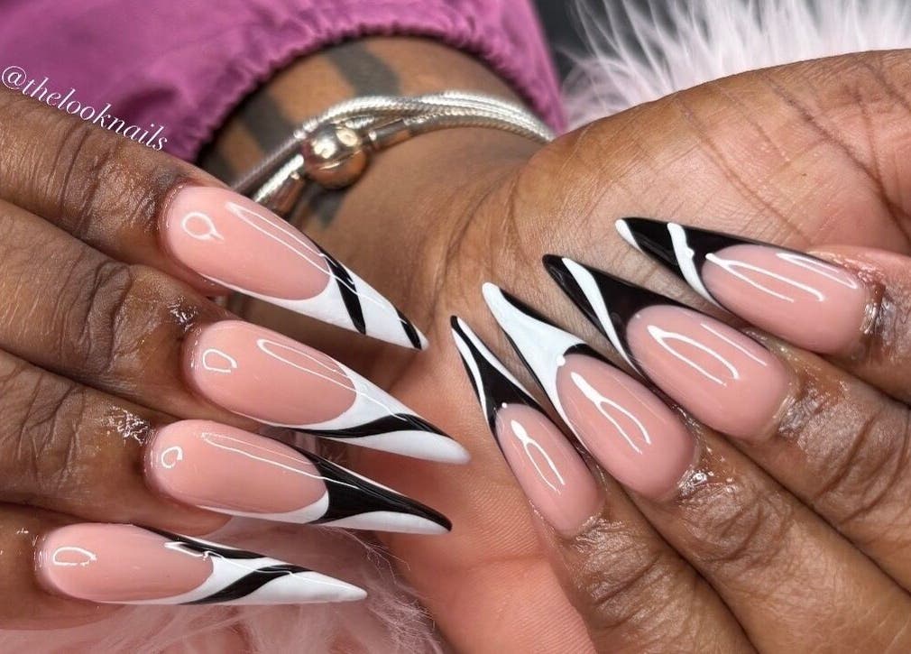 Stylish stiletto nails with black and white design by The Look Nails By Taria, Marsh Harbour, Central Abaco, BS.