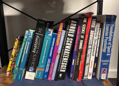 Books on sports therapy at A&M Physiotherapy, Kenilworth, England, GB
