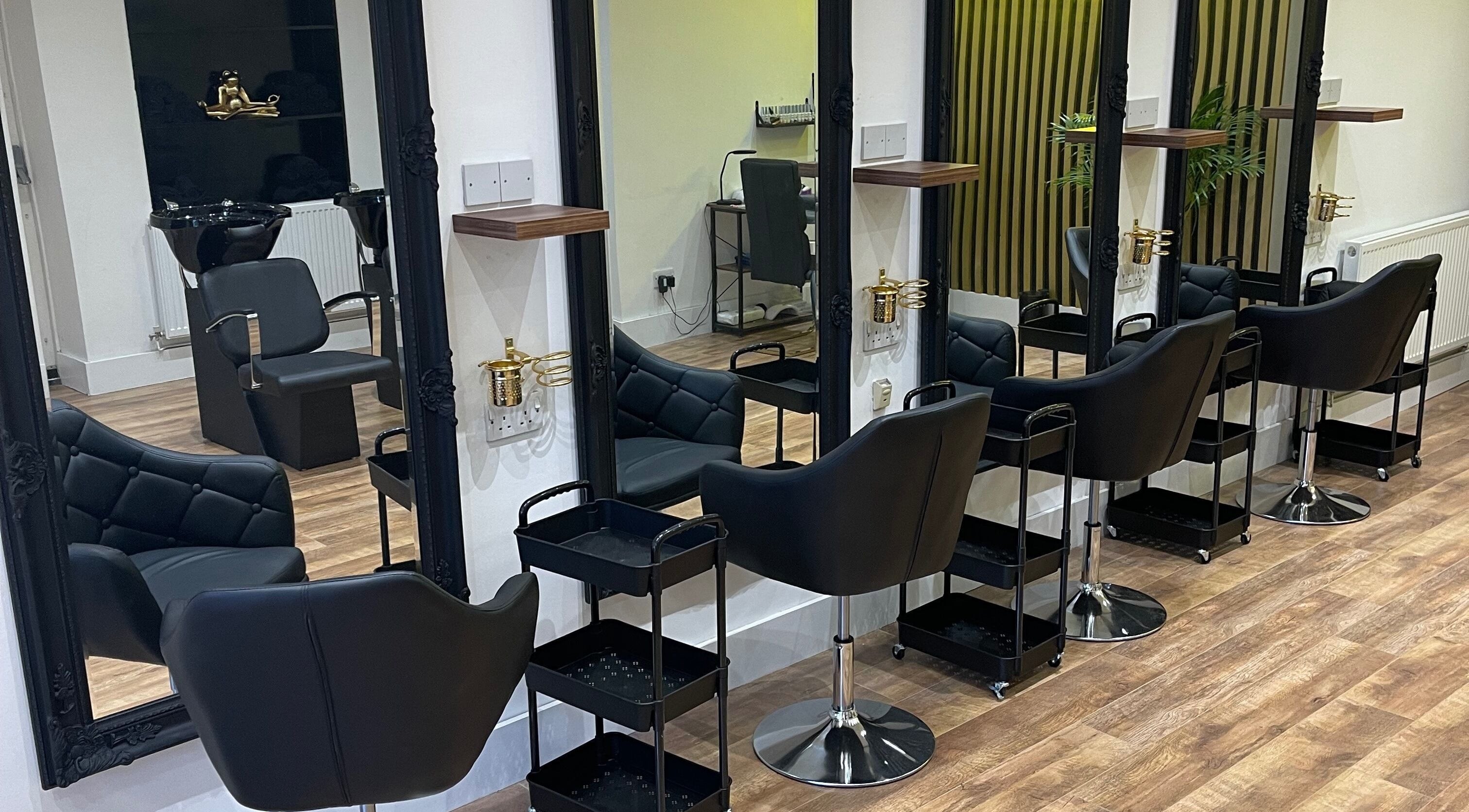 Amoura Hair salon interior with elegant styling stations in Warrington, England, GB.