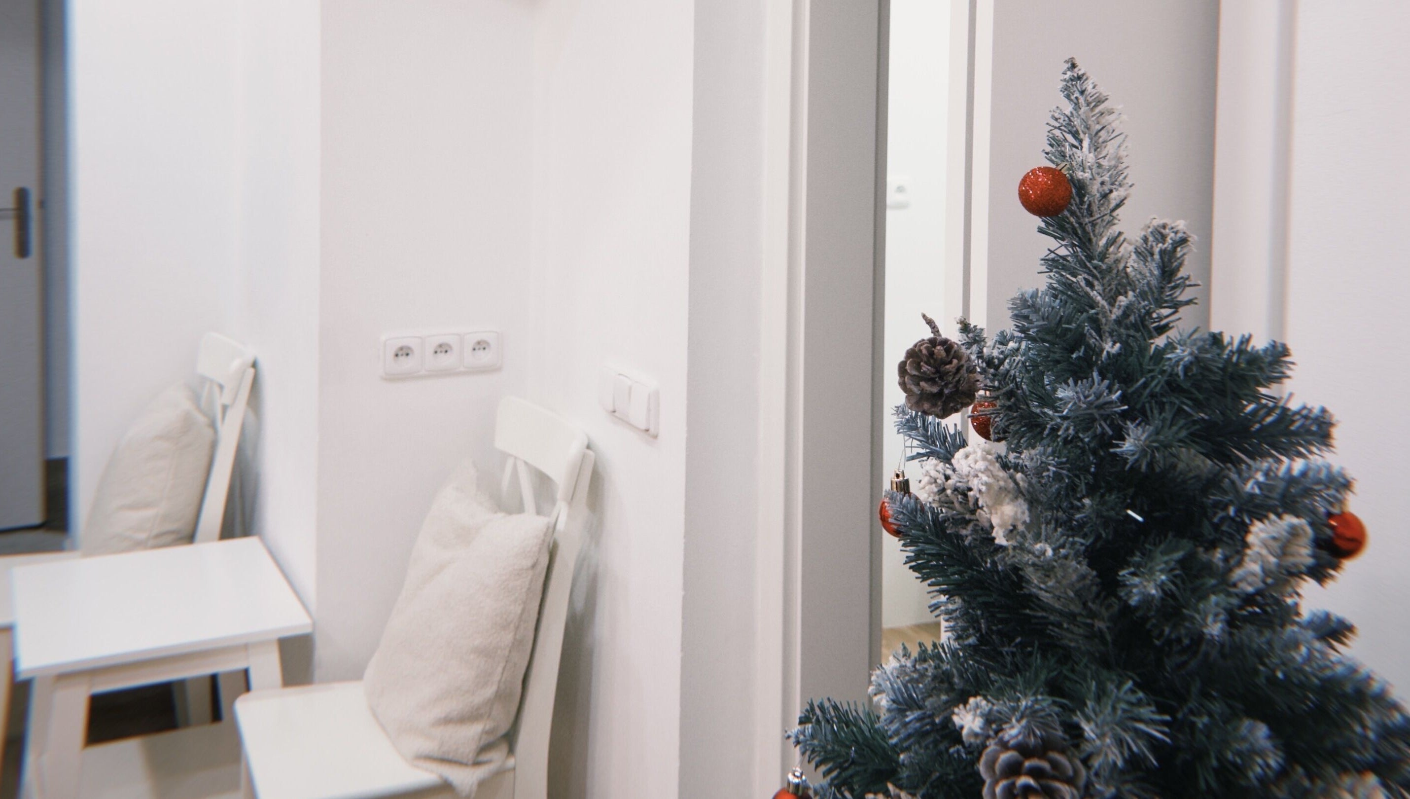 Cozy holiday decor at Bali & Sport Massage, Hlavní Město Praha, CZ, featuring a pinecone adorned tree.