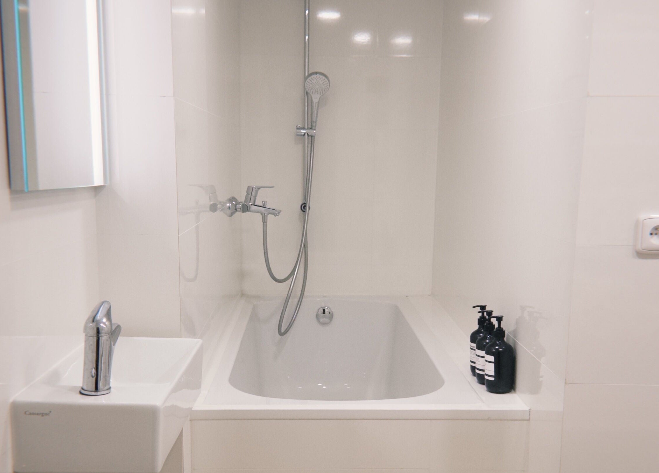 Elegant bathroom at Bali & Sport Massage, Hlavní Město Praha featuring a modern tub and sleek fixtures.