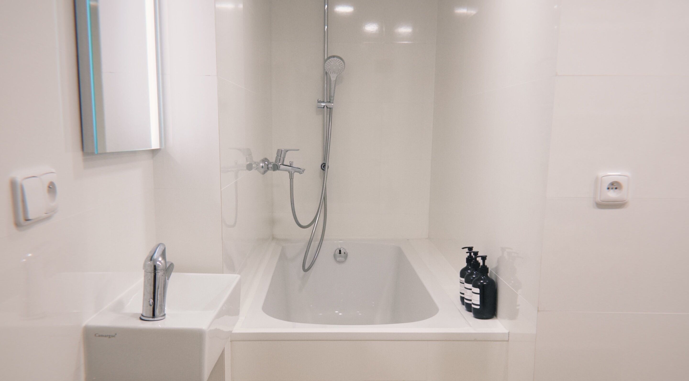 Elegant bathroom at Bali & Sport Massage, Hlavní Město Praha featuring a modern tub and sleek fixtures.