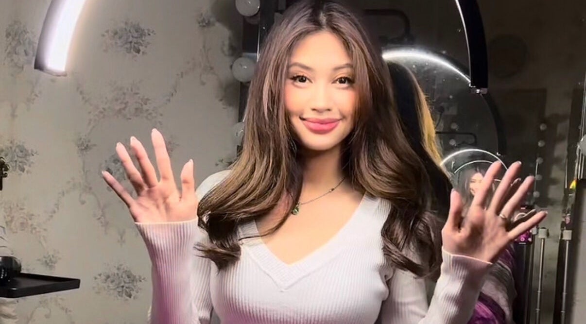 Happy woman at Lashed Aesthetic, Petaling Jaya, Selangor, MY, showcasing beauty and style.