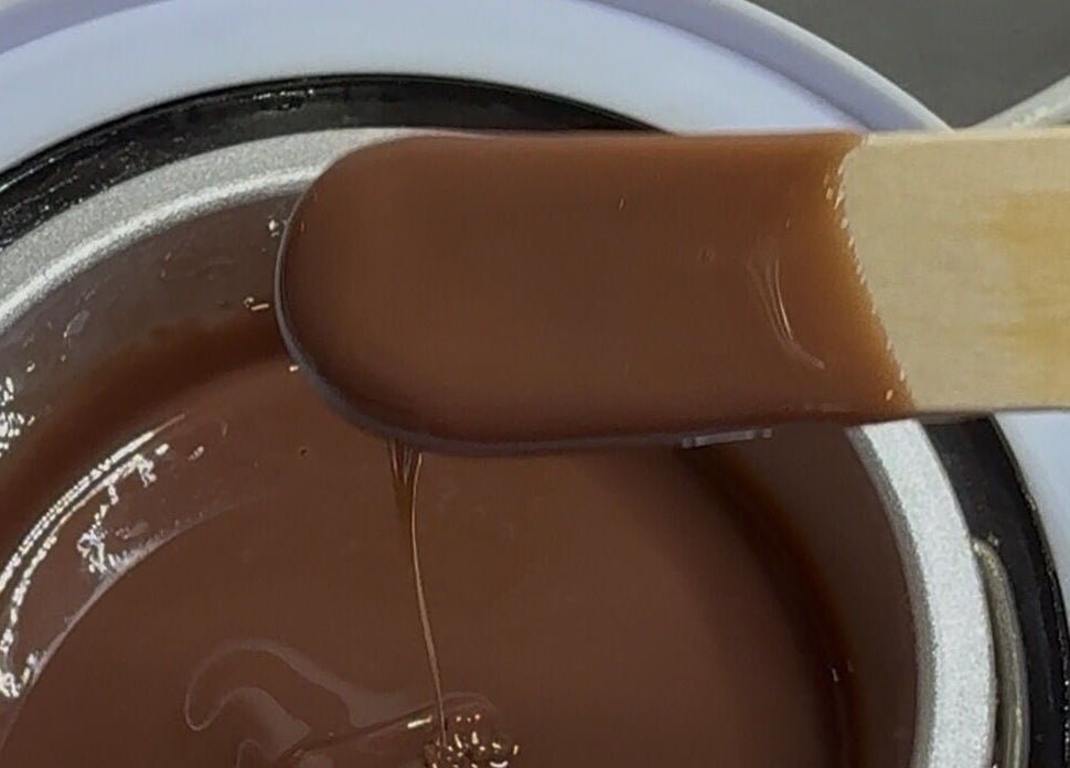 Warm chocolate wax at Edna Neres, Vila Nova De Gaia, Porto, PT, ready for a luxurious beauty treatment.