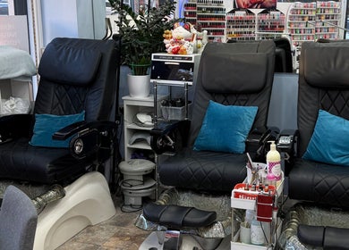 Comfortable pedicure chairs at American Nail Design, London, England, GB, ready for a relaxing session.