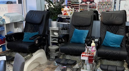 Comfortable pedicure chairs at American Nail Design, London, England, GB, ready for a relaxing session.