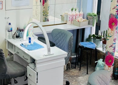 Inviting nail station at American Nail Design, London, England, GB with floral accents and modern decor.