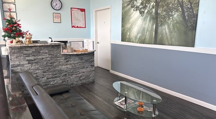 Tranquil reception area at Massage Randolph, Colesville, Maryland, US with cozy seating and welcoming decor.