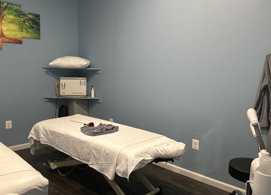 Massage room at Massage Randolph in Colesville, Maryland, US with calming decor and treatment table.