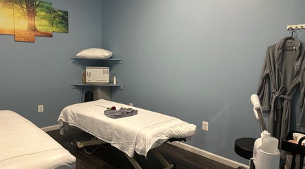 Relaxing massage room at Massage Randolph in Colesville, Maryland, US, featuring a calm ambiance.