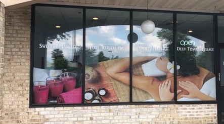 Front window of Massage Randolph in Colesville, Maryland, US showcasing massage services and ambiance.