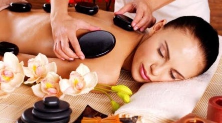 Hot stone massage at Massage Randolph in Colesville, Maryland, US, offering ultimate relaxation and tranquility.