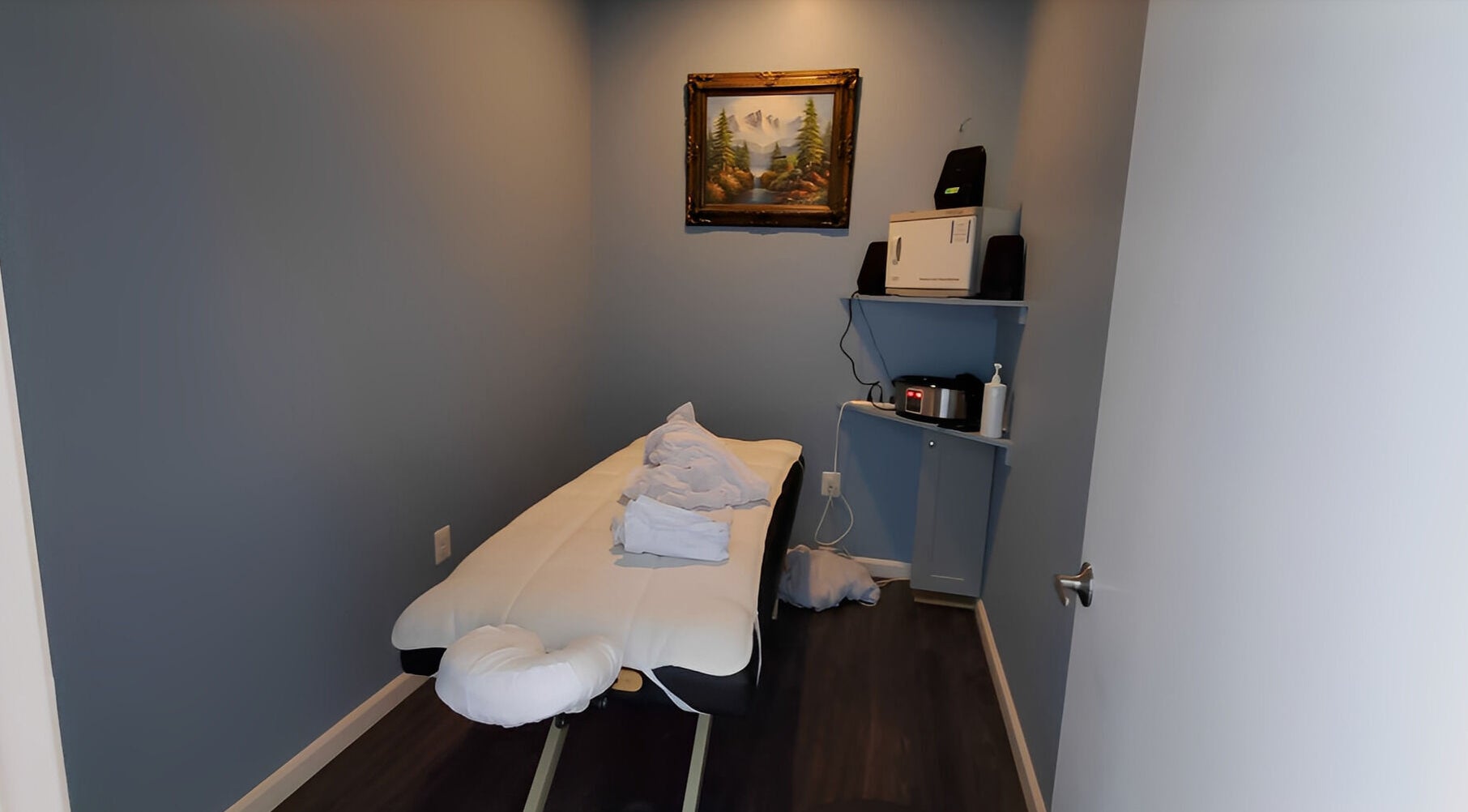 Tranquil massage room at Massage Randolph in Colesville, Maryland, US with a massage table and soothing decor.