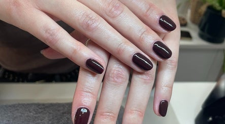 Elegant manicured dark plum nails at Radiant by Rosie in Bradford, England, GB.