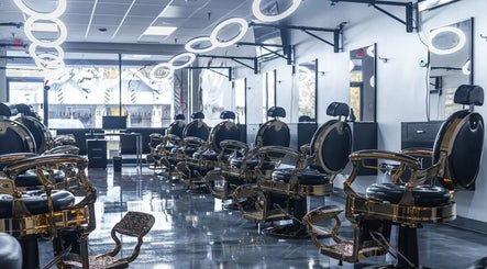 Elegant interior of London Clippers salon in Lake Zurich, Illinois with chic barber chairs and mirrors.