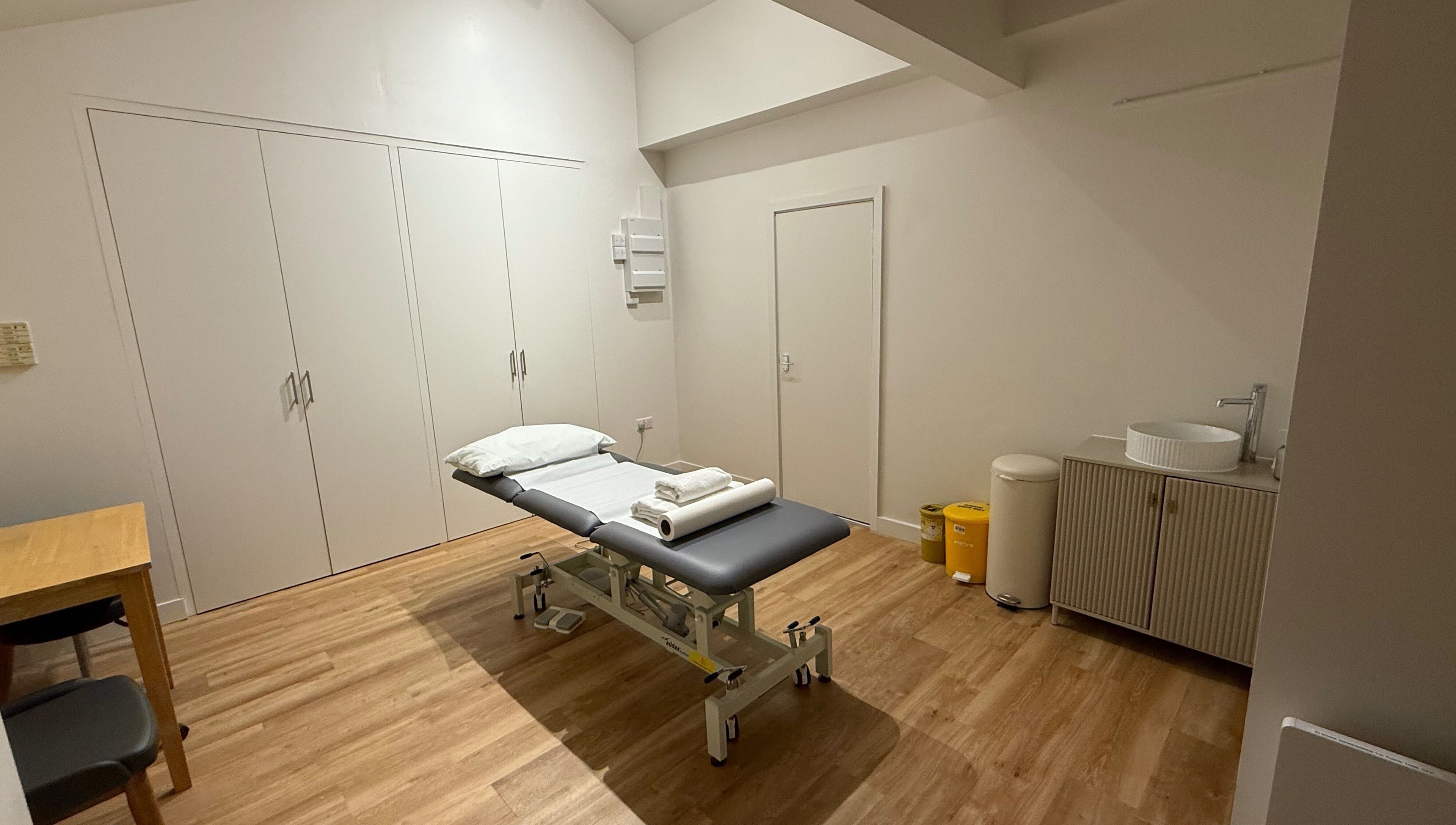 Rehab Joy wellness room with treatment bed, sleek sink, and calming decor in London, England, GB.