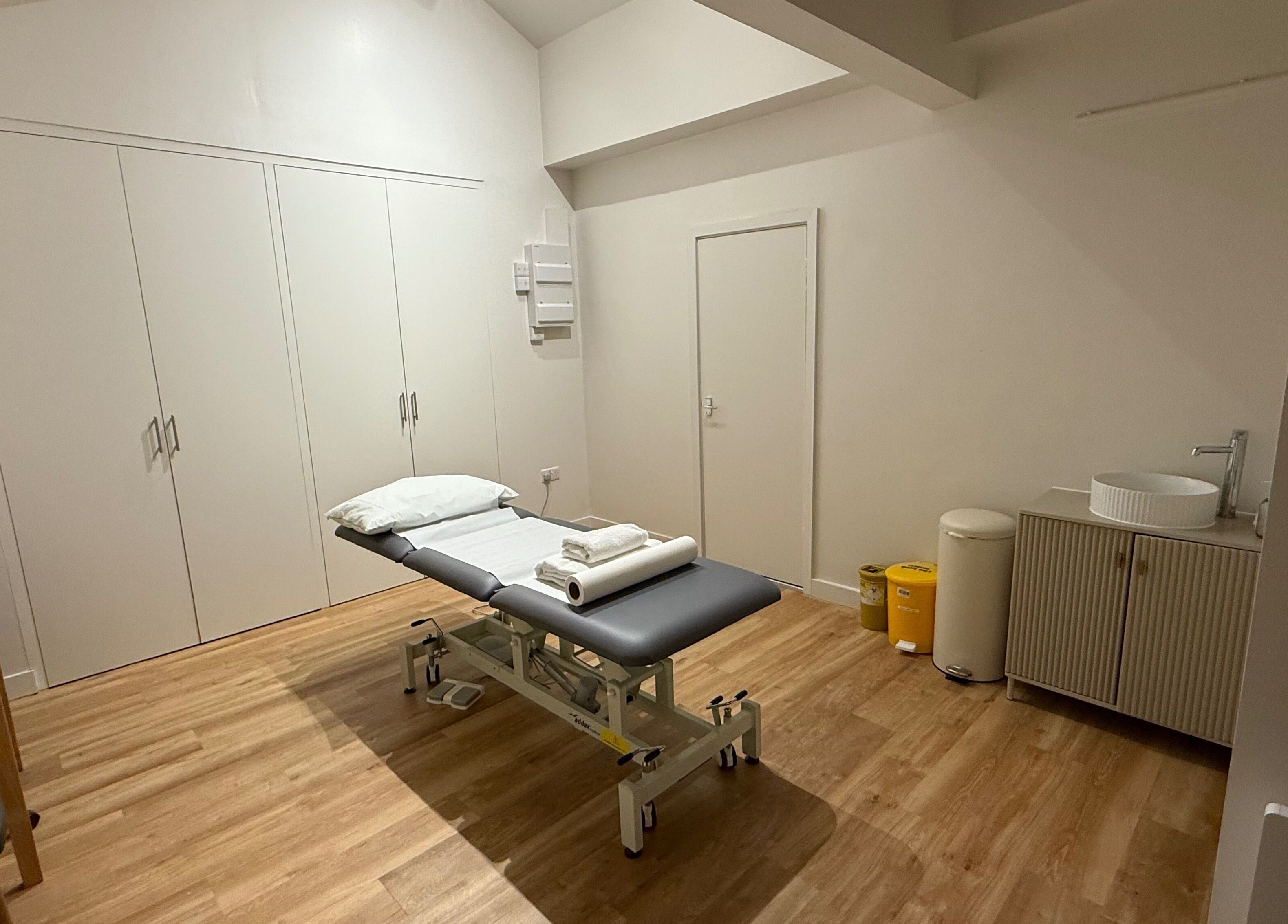 Rehab Joy wellness room with treatment bed, sleek sink, and calming decor in London, England, GB.