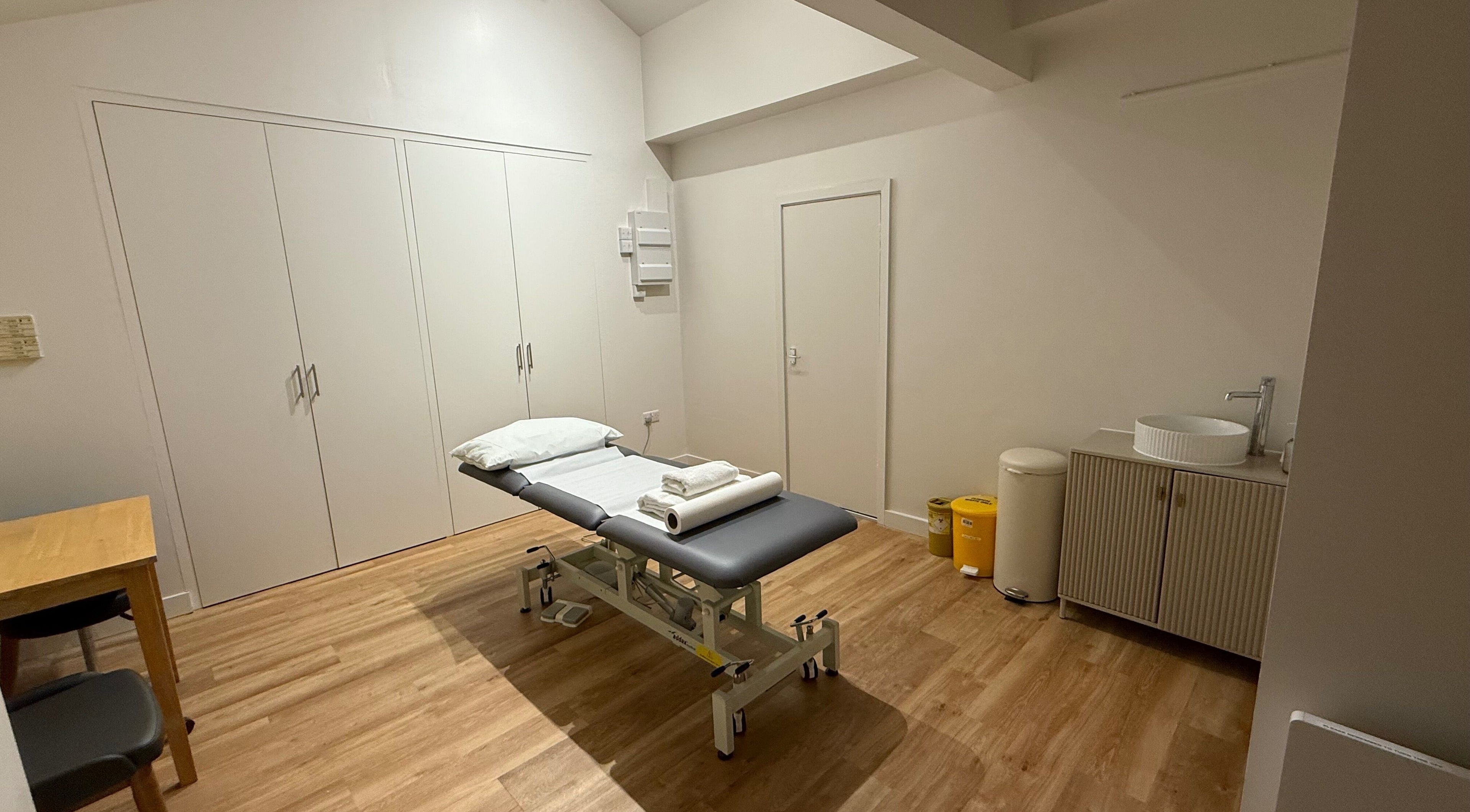 Rehab Joy wellness room with treatment bed, sleek sink, and calming decor in London, England, GB.