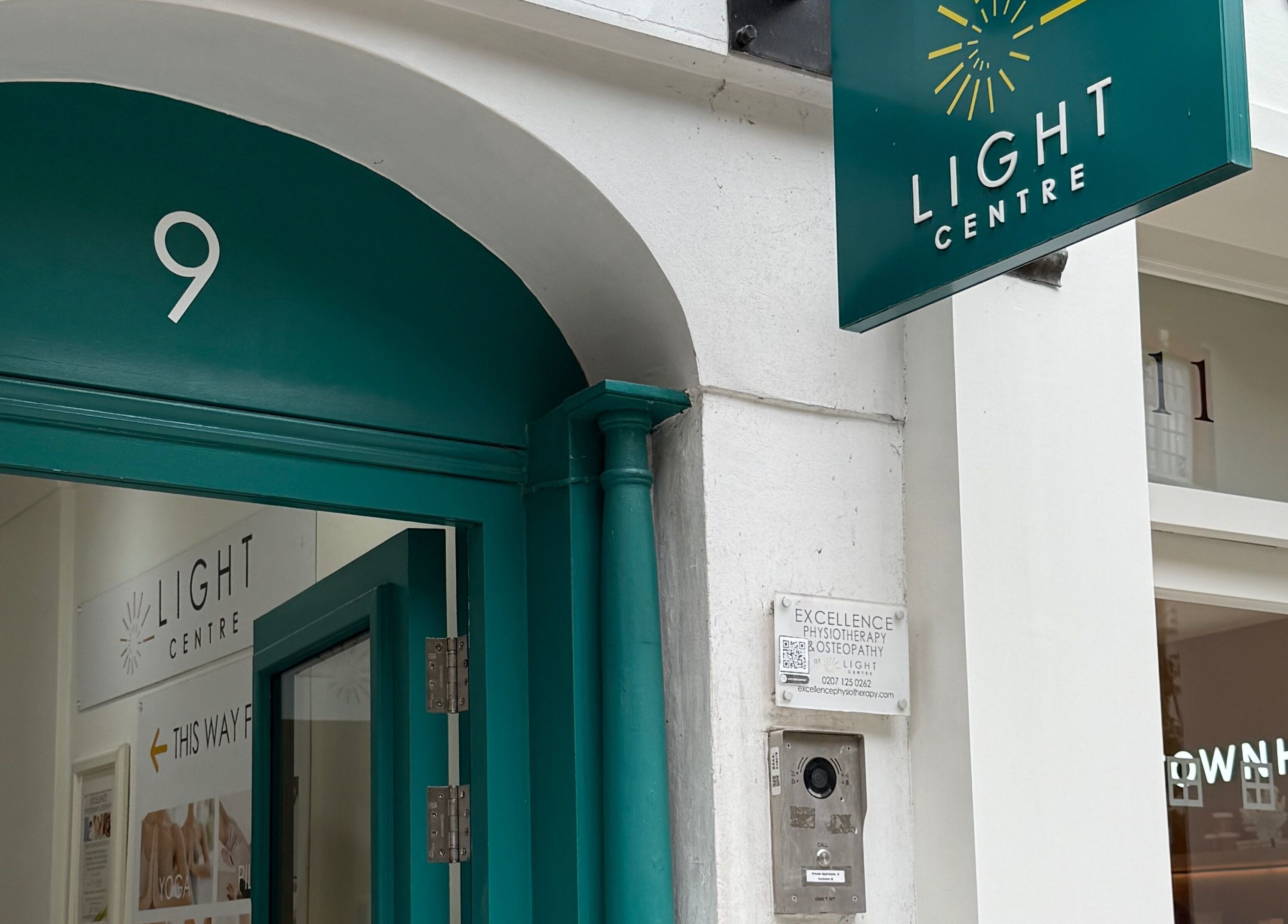 Entrance of Rehab Joy, London, England, GB with signage and glass doors.