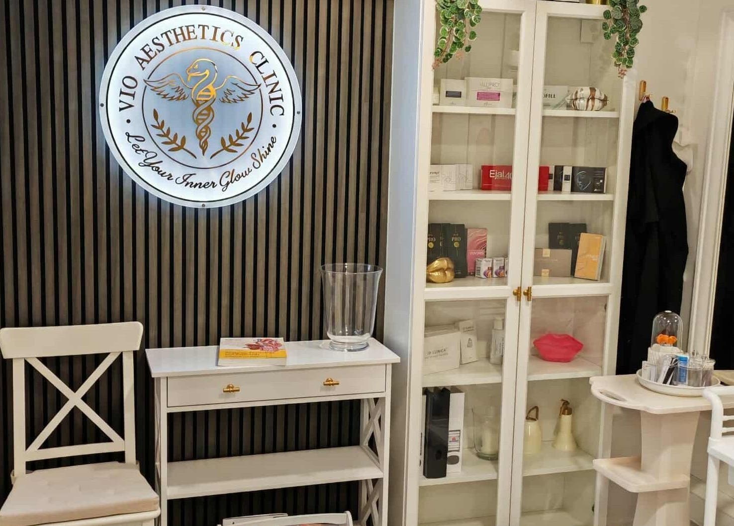 Reception area of VIO AESTHETICS CLINIC in Reading, England, GB featuring modern decor and branding.