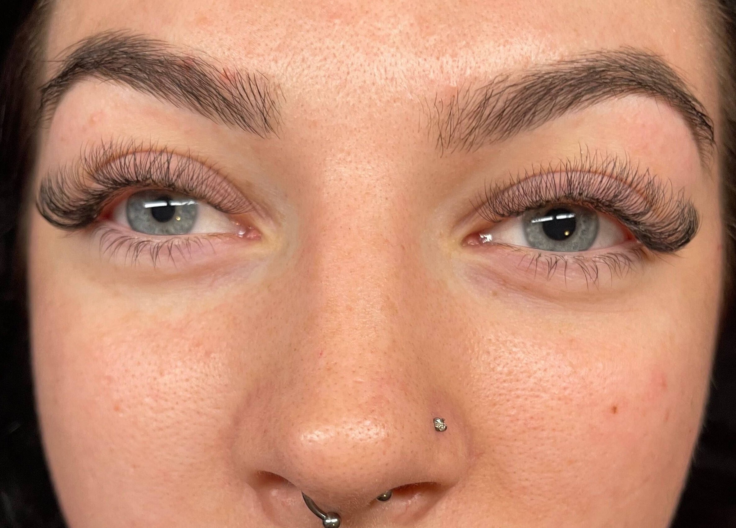 Close-up of a woman with expertly styled lashes at Beautybyjmn, Holmview, Queensland, AU.