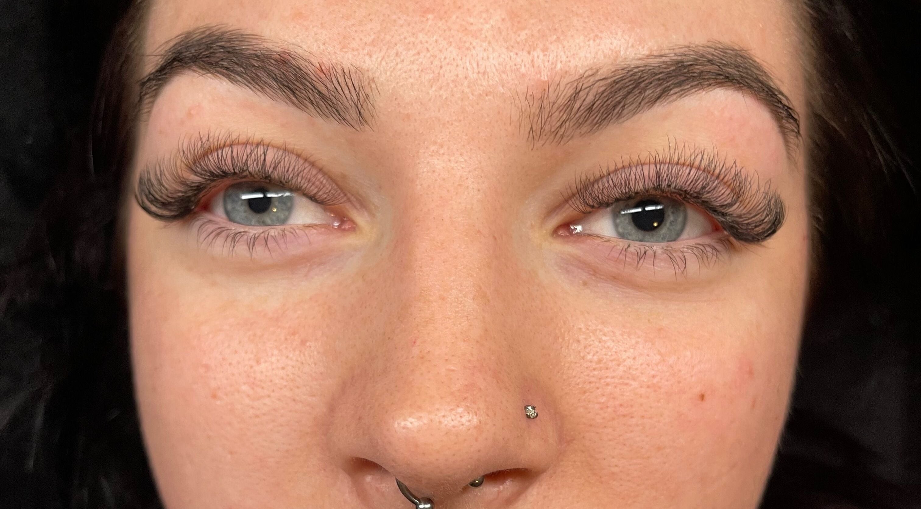 Close-up of a woman with expertly styled lashes at Beautybyjmn, Holmview, Queensland, AU.