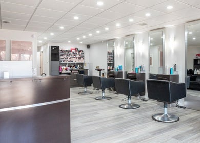 Stylish seating and modern design at Waxman salon in Mississauga, Ontario, CA, showcasing elegance and comfort.
