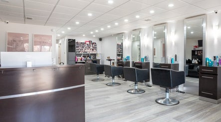 Modern interior of Waxman salon in Mississauga, Ontario, CA, featuring stylish hair styling stations and decor.