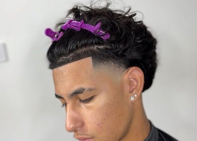 Stylish haircut at AMPBARBERSHOP, Lisboa, Lisboa, PT, featuring precision clipper fade and defined lines.